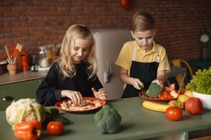 Canva Children Slicing Vegetables